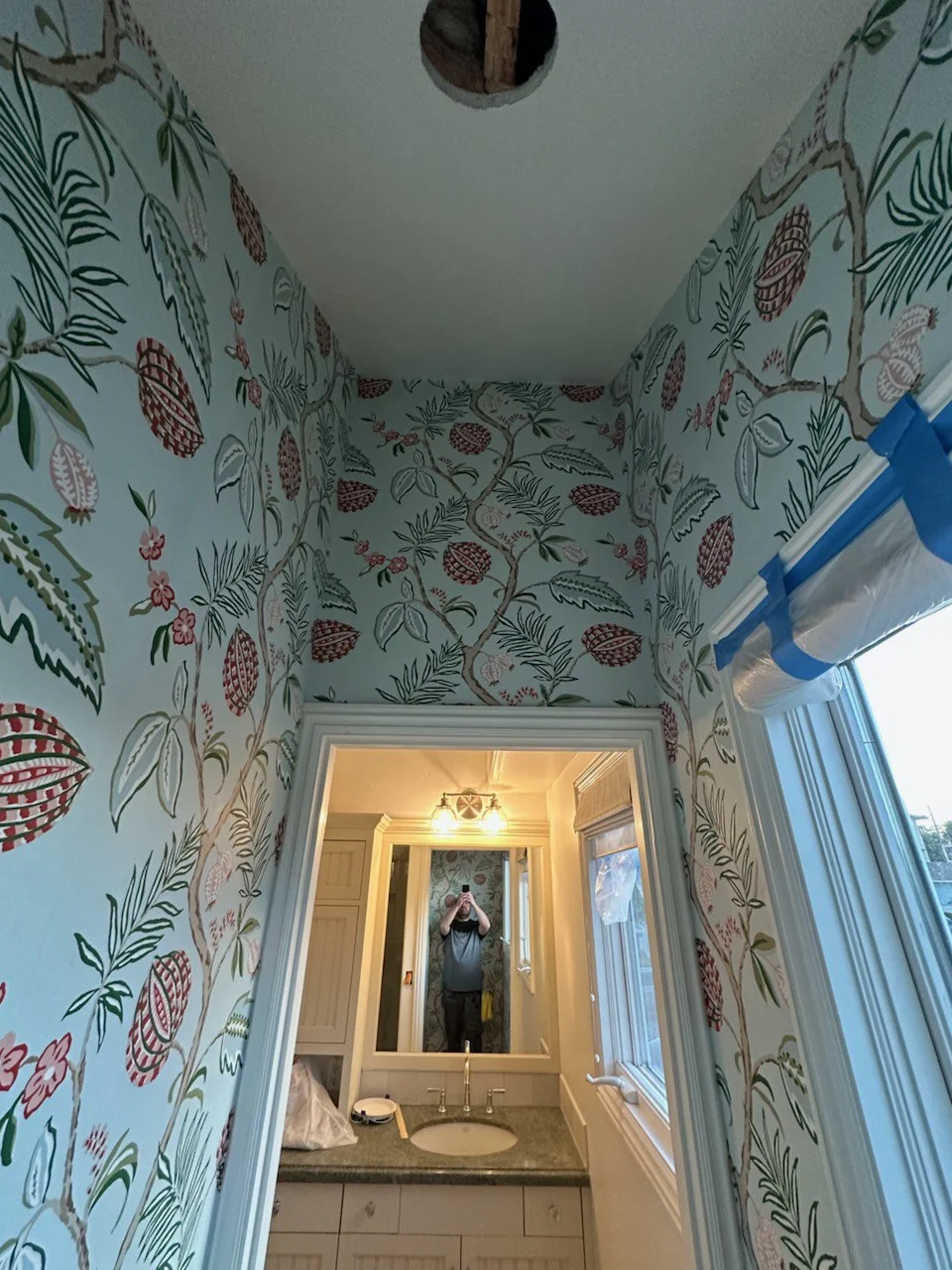Beautiful nursery with custom wallpaper installation